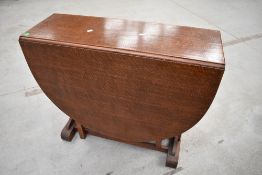 An early to mid 20th Century oak gateleg table