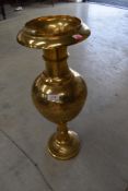 A vintage brass Eastern style vase, height approx. 60cm