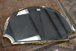 An early 20th Century brass framed wall mirror, width approx. 70cm