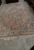 A modern Chinese carpet square having pink ground, approx. 270 x 180cm