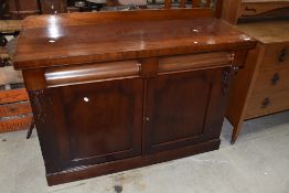 A Victorian mahogany chiffoneir/sideboard having ledge back and double shaped frieze drawers,
