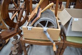 A barrel wool carder made by David G Barnett and a pair of teasers