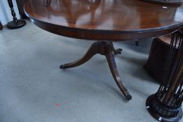 A reproduction Regency circular dining table, with inlay detailing to splay legs, diameter approx.