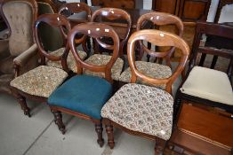 A harlequin set of six Victorian mahogany balloon back chairs