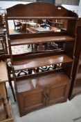 A 19th Century oak waterfall style bookcase with double cupboard under, approx height 142cm, width