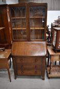An early to mid 20th Century oak and ply bureau bookcase