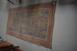 A traditional Persian style rug , edged with branded strip, R W Weekes Ltd, Tunbridge Wells, approx.