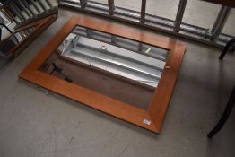A modern pine wall mirror, approx. 92 x 67cm