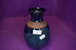 An arts and crafts style studio pottery vase by Vallauris France signed to base with two tone blue