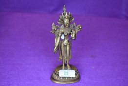 A bronze cast figure of a Tibetan Buddhist Goddess Tara standing 17cm approx