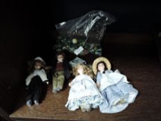 A bag of vintage marbles and four porcelain headed dolls