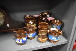 A selection of Victorian lustre ware milk cream and water jugs including hand decorated designs