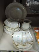 A selection of lustre and gilt finish cups and saucers, side plates, jug and basin and more.