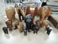 A collection of wooden elephants.