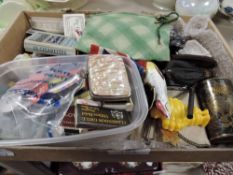 A mixture of vintage and antique items including coin purses, cigarette cards,badges and more.