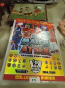 A selection of football trading cards and a vintage wooden block puzzle.
