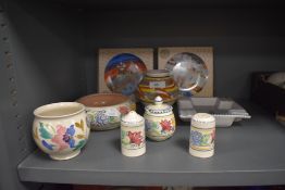A selection of mid century and later hand decorated Poole pottery including condiments and boxed