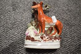 A selection of antique Staffordshire flat back figures including spill vase and