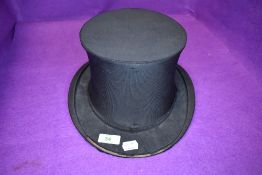 A late Victorian collapsible or fold away top hat retailed by Harrods London Easy Fitting some