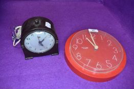 Two clocks including bakelite Smiths alarm clock and Westclox red cased