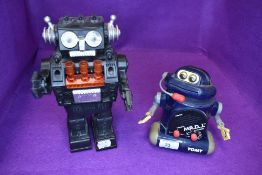 Two childrens toy robots one Hong Kong made and similar Tomy MR D.J