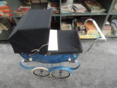 A vintage Silver Cross Dolls Pram on twin axel with sprung frame having dark blue canopy, cream