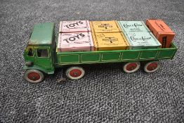 A 1940's Mettoy tin plate and clockwork TMC 8 wheel Wagon and Trailer in green with yellow