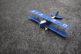 A Meccano hand built model Bi-Plane, G-EVTX in blue and white with pilot