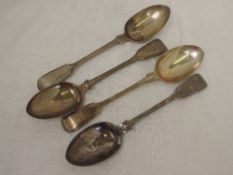 Four Victorian silver table spoons of fiddle back form having reeded decoration to rims and engraved