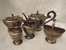 A Dutch silver five piece breakfast tea set of tapered oval form with pineapple finials, wooden