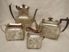 A Victorian Aesthetic movement silver four piece tea service of canted rectangular form having