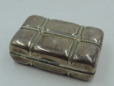 A Victorian silver lidded trinket box in the form of a parcel tied with string, with gilt