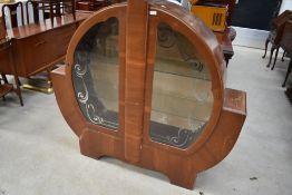 A 1930s part walnut display cabinet of typical Art Deco design, width approx. 135cm, a little