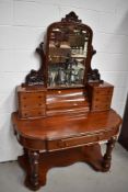 A Victorian mahogany Duchess style dressing table