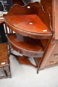 A reproduction mahogany corner wash stand