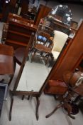 A vintage stained frame cheval mirror