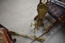 A selection of brass fireside items including fan style fire screen
