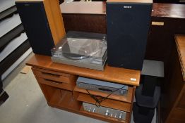 A selection of vintage hi-fi equipment in teak cabinet including NAD C422 Tuner