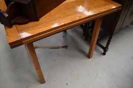 An early to mid 20th Century golden oak topped drawer leaf dining table, approx. 92 x 92cm