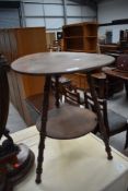 A Victorian stained frame tripod table having circular top and undertier , with simulated bamboo