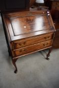 An early 20th Century stained frame bureau on cabriole legs