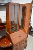 An early 20th Century oak bureau bookcase having Deco style handles