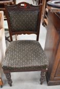 A Victorian mahogany dining chair having overstuffed seat and back