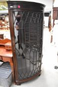 An early to mid 20th Century mahogany bow fronted corner display, height approx. 167cm