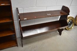 A late 19th or early 20th Century book trough/shelf, semi Gothic frame, width approx. 100cm