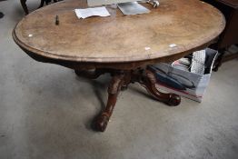 A 19th Century walnut and mahogany loo table, as found, leg loose