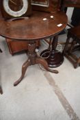 A 19th Century oak pedestal table having circular top, diameter approx. 56cm, on turned column