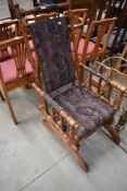A late Victorian spindle frame American style rocking chair