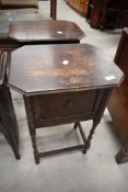A pair of early 20th Century oak bedside pot cupboards on twist legs