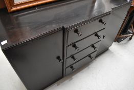 A vintage dark stained breakfront sideboard, width approx. 137cm